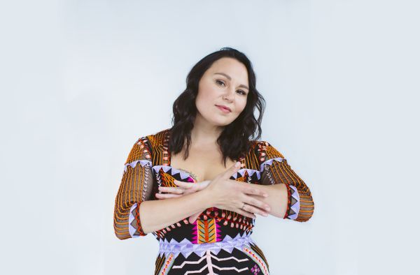 Tanya Tagaq posing with arms crossed.