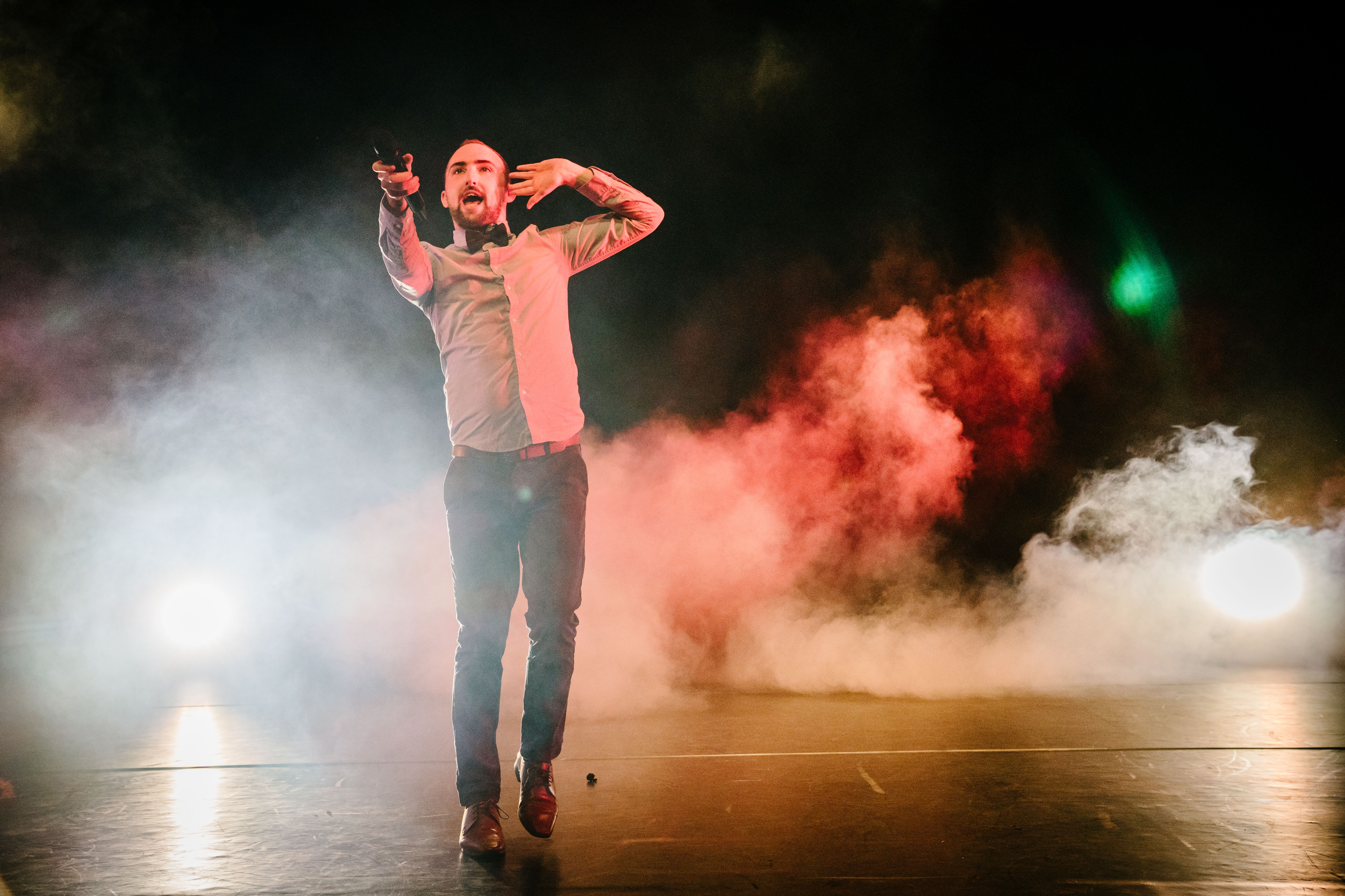 Paul O'Donnell posing in front of smoke and lights. 