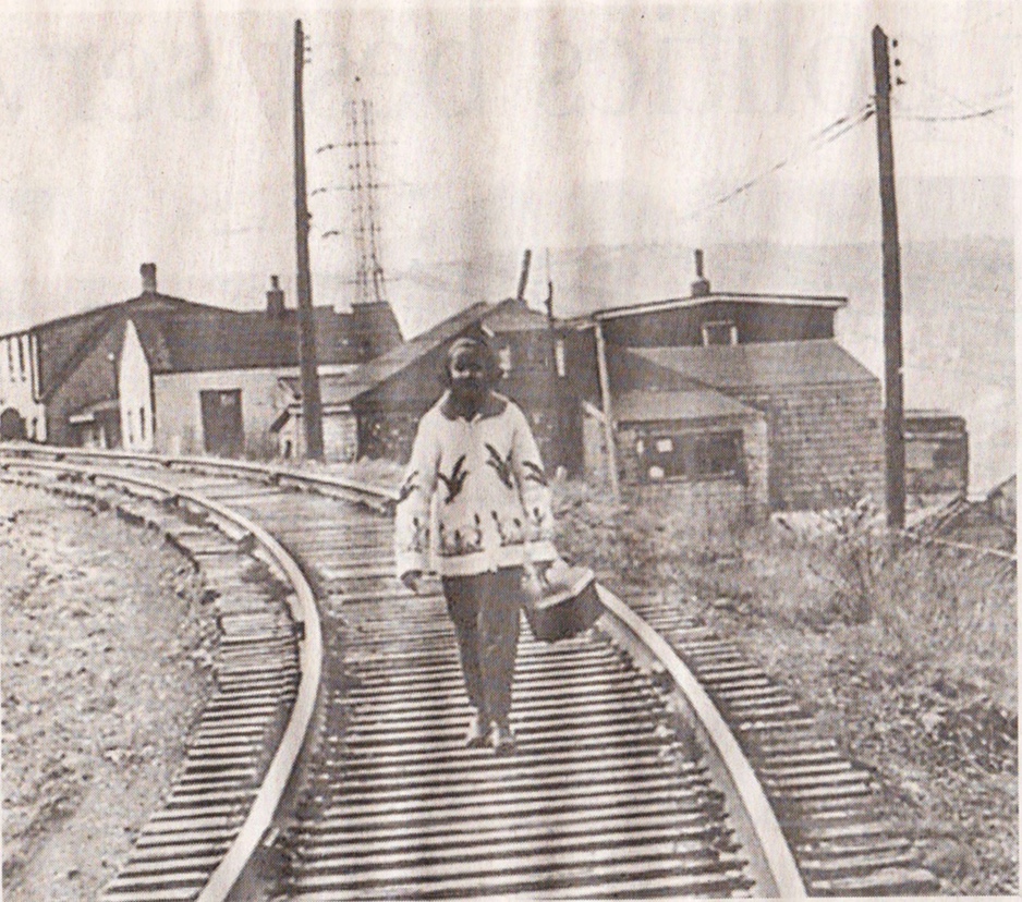 Woman walking down tracks in Africville