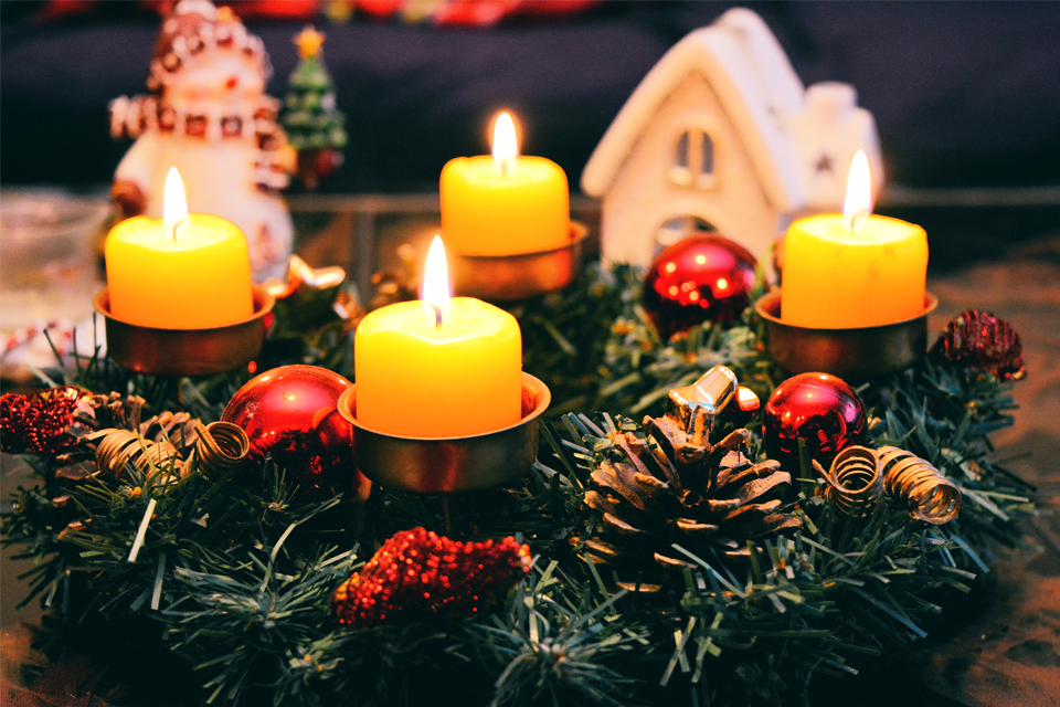 Christmas candles glowing on a table