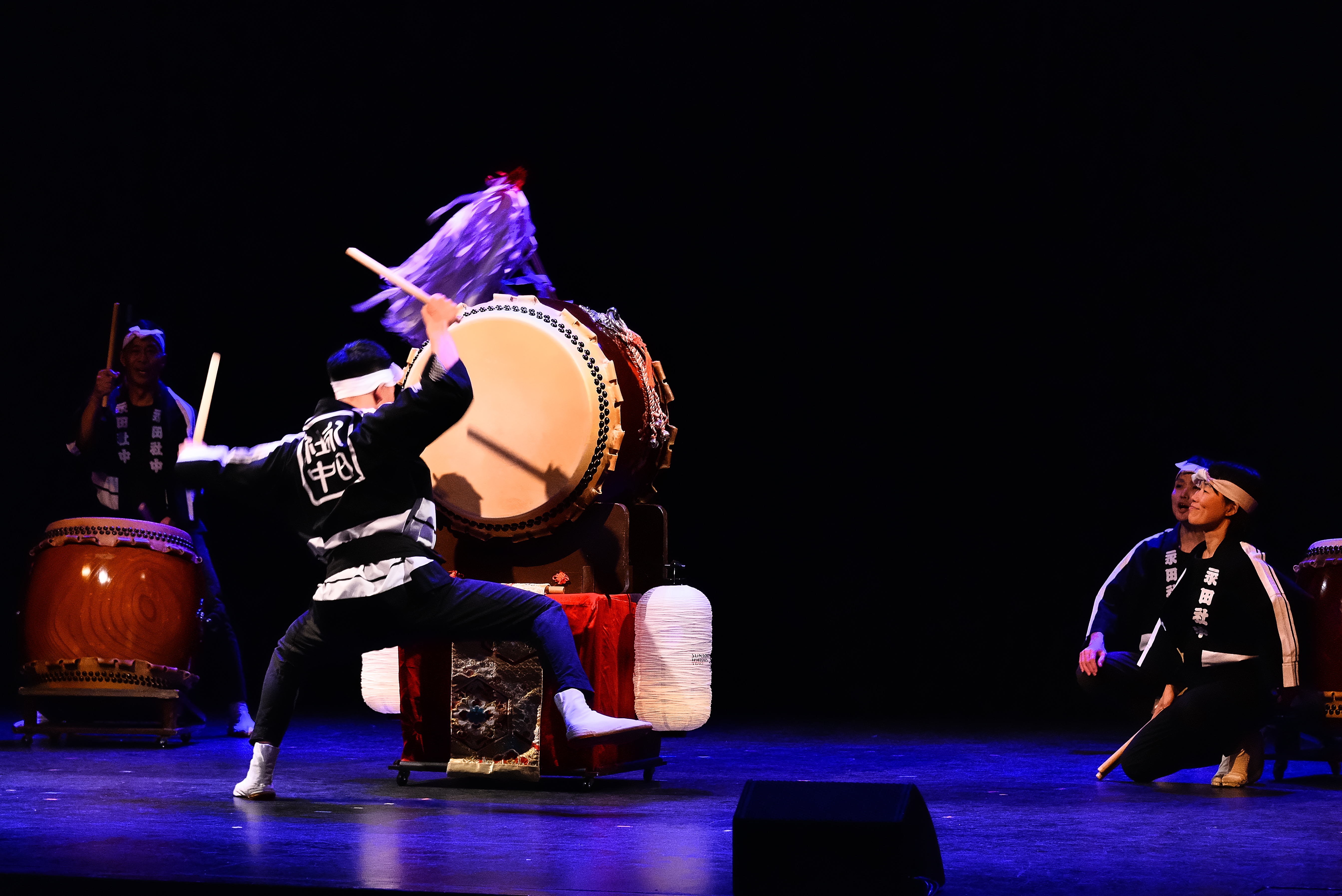 Drummers performing on stage