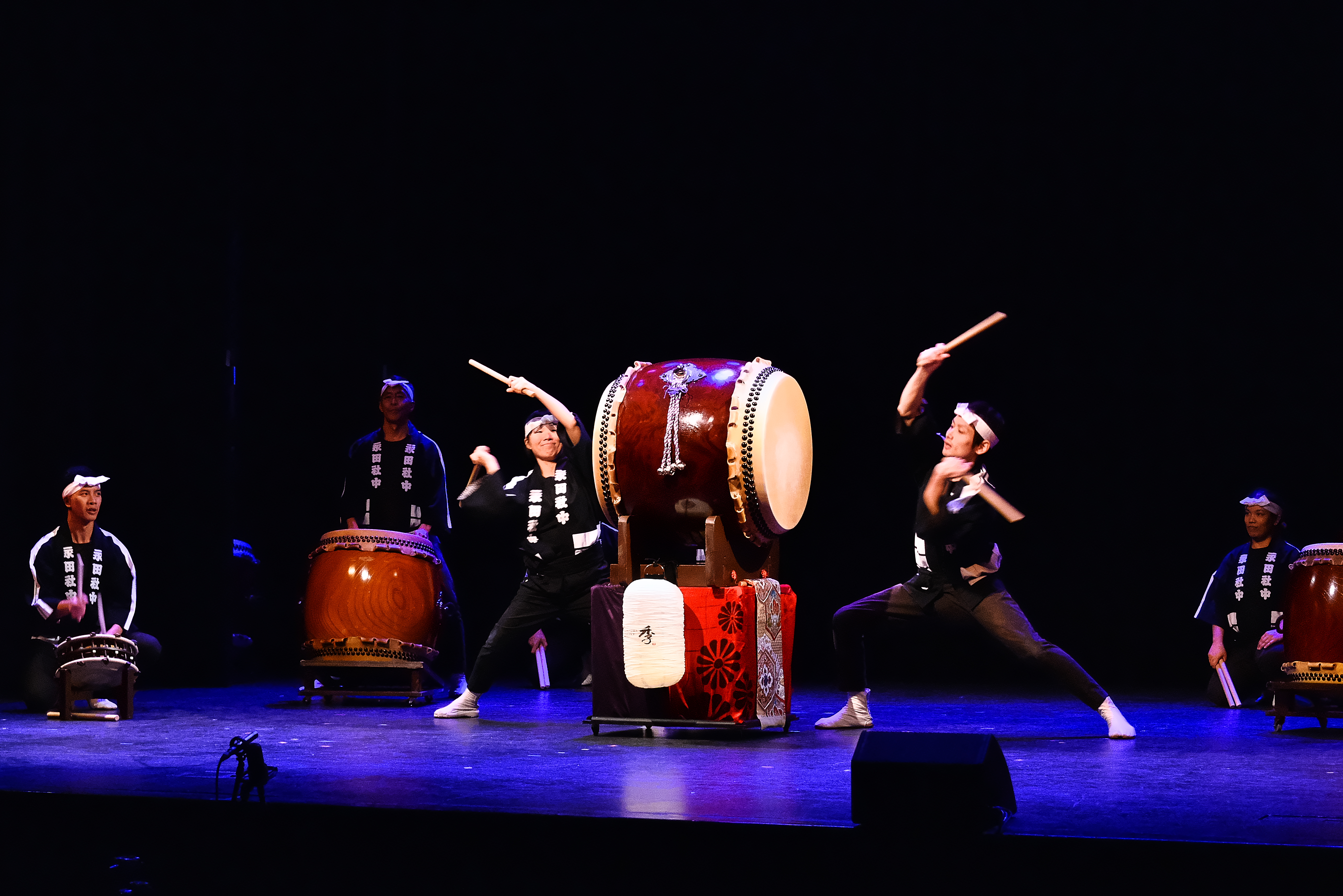 Drummers performing on stage