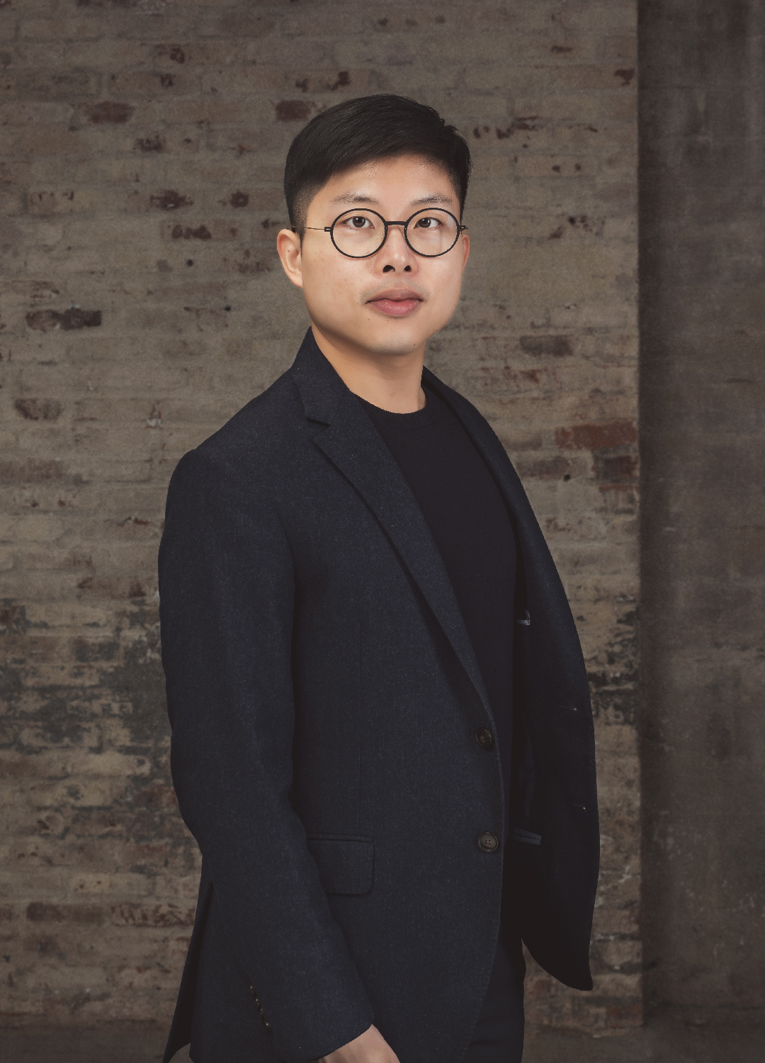 portrait of an asian gentleman dressed in all black