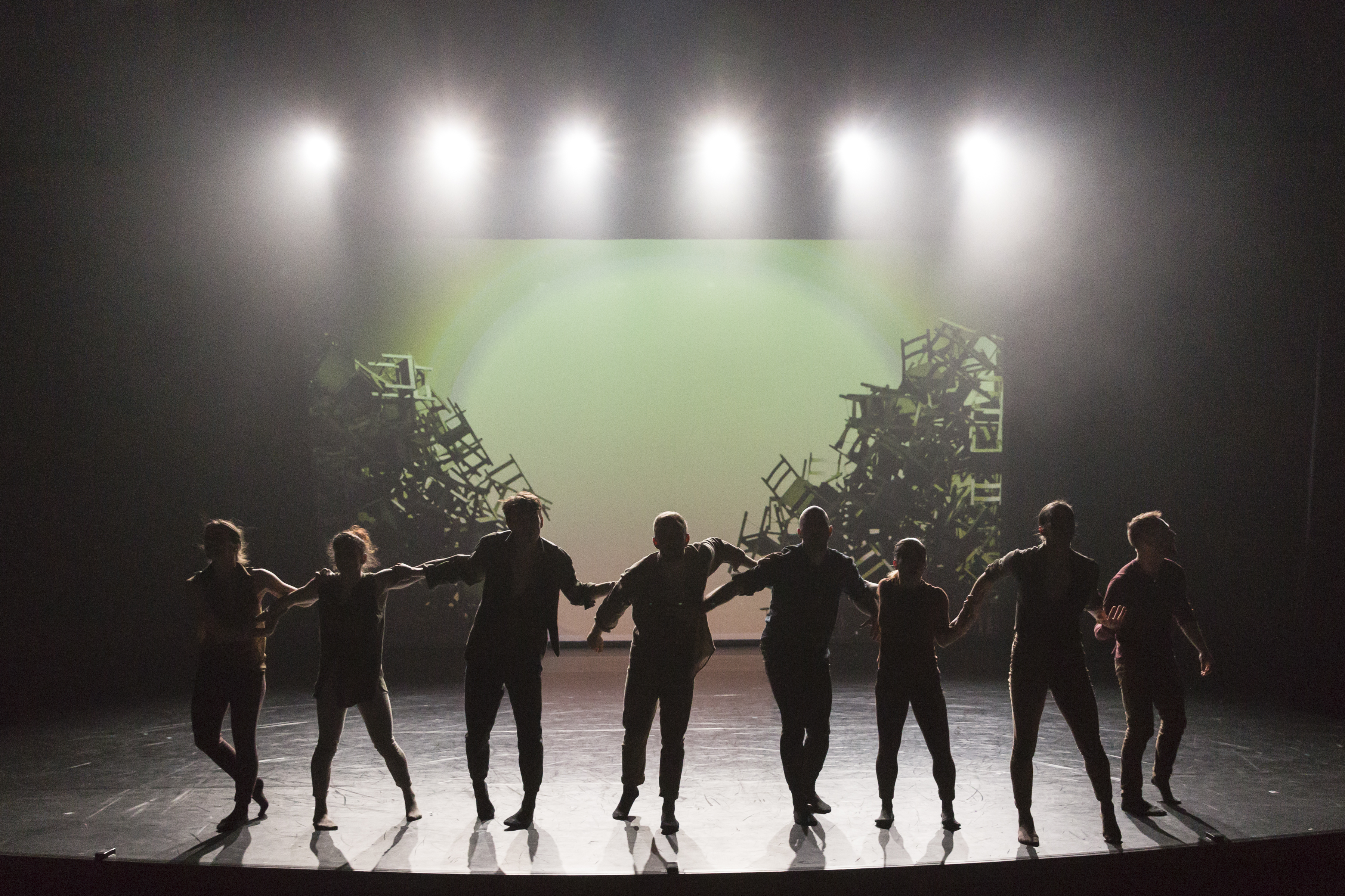 Dance team members standing on stage