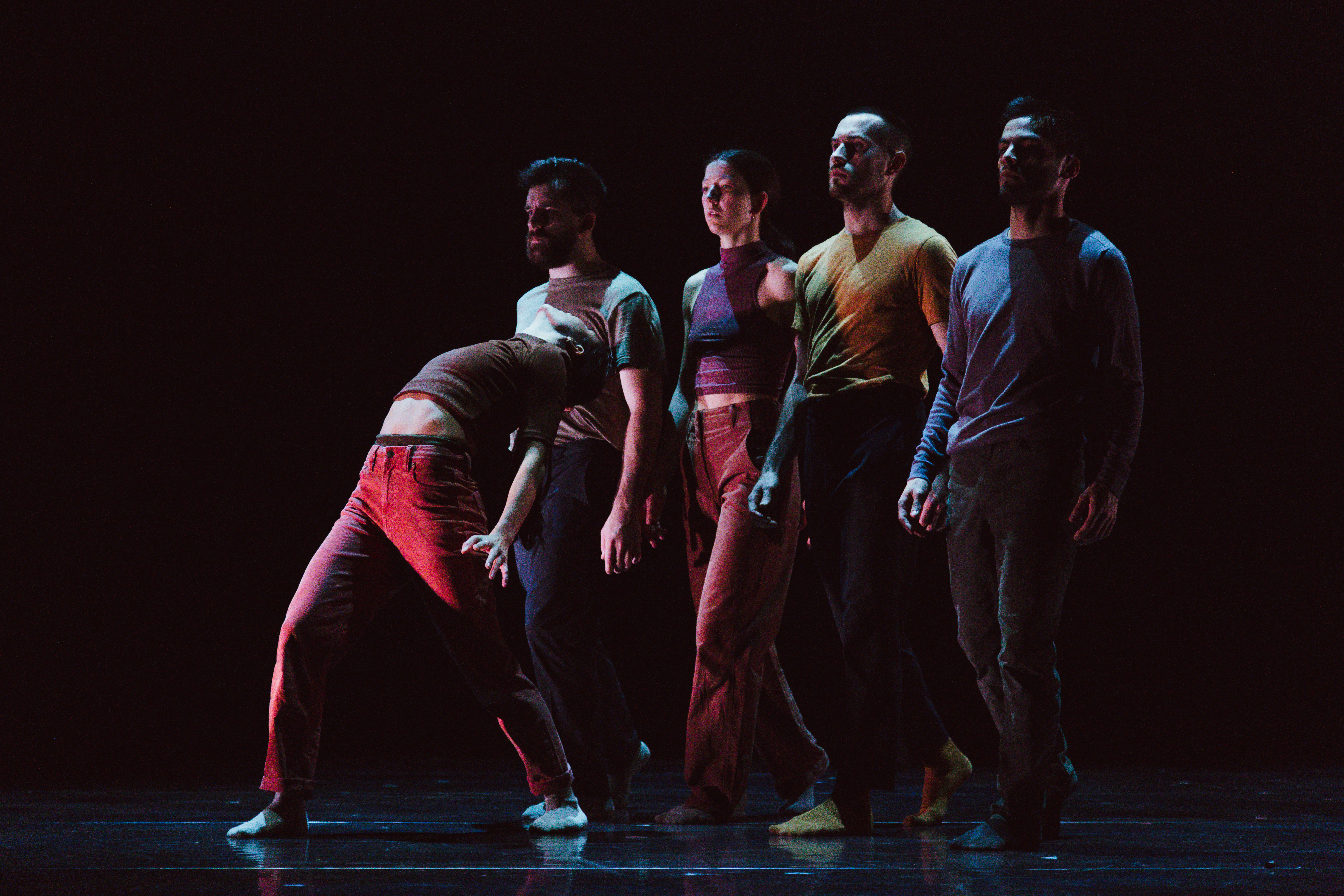 Dancers performing on a stage.