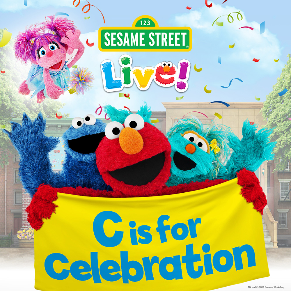 Sesame Street Live! characters dancing on stage.