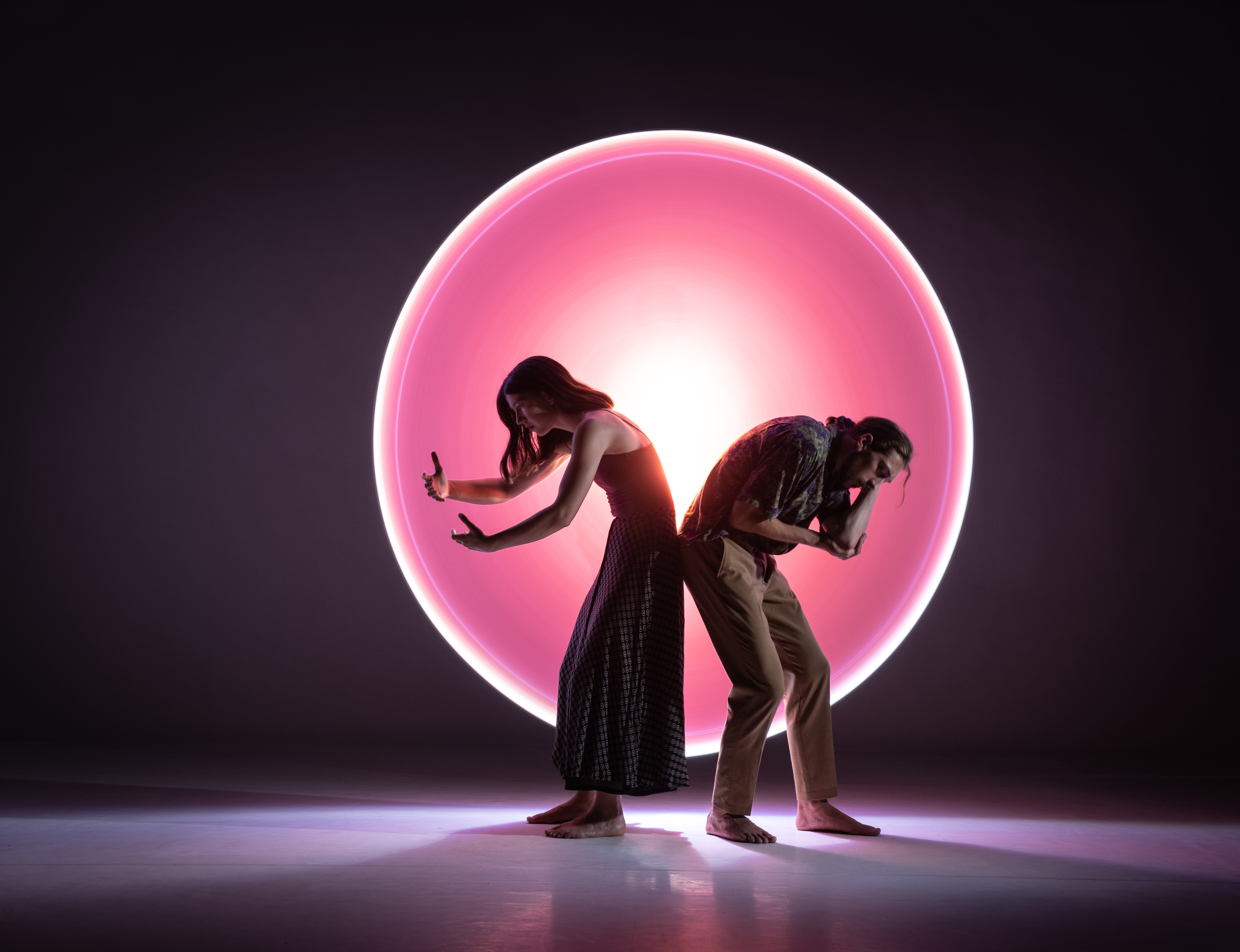 Dancers performing on a stage.