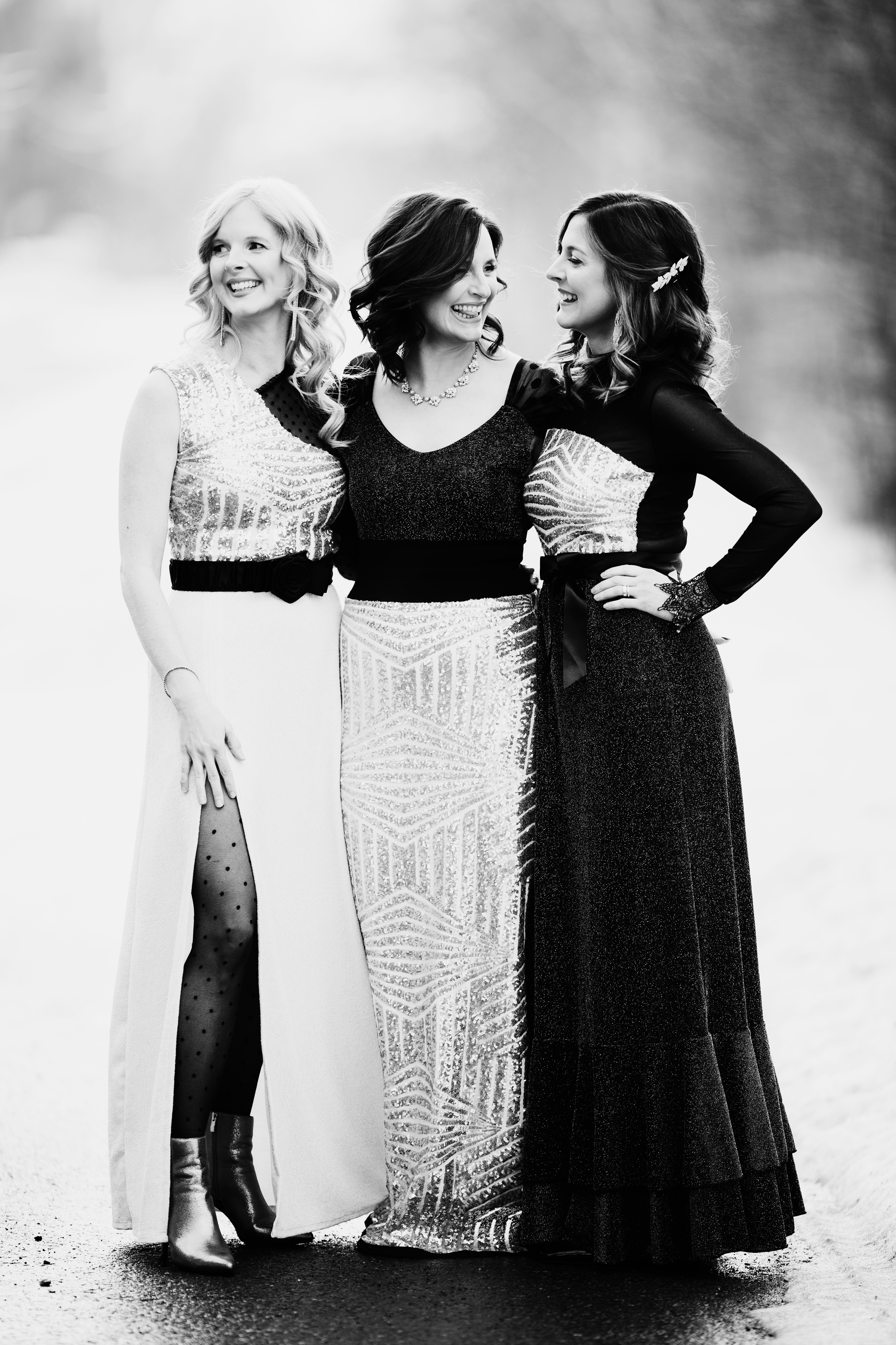 three beautiful sisters in a black and white picture