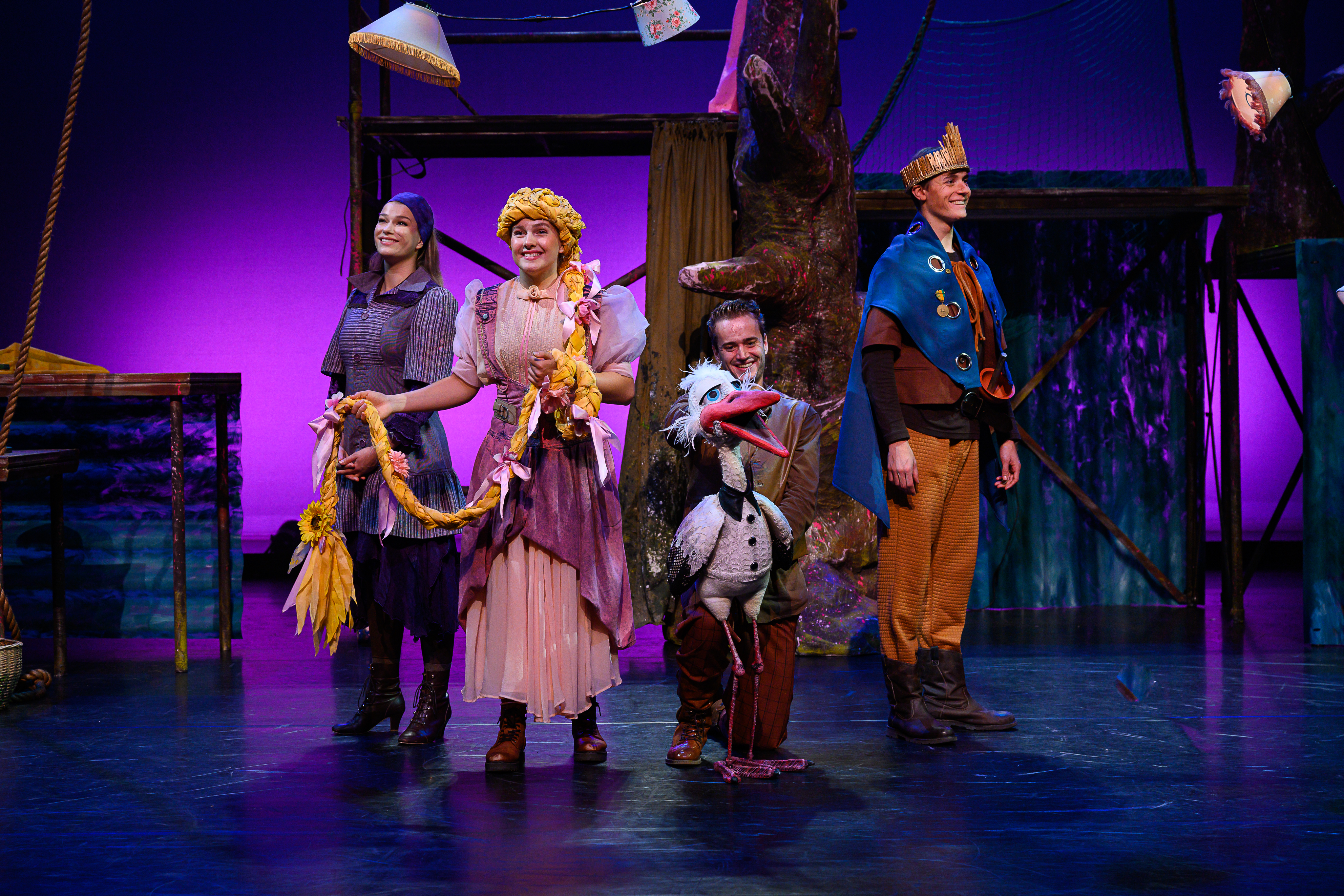 Actors on a stage performing the musical Rapunzel