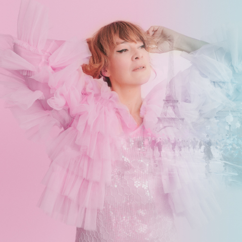 Jill Barber in pink on a pastel background of pink and blue