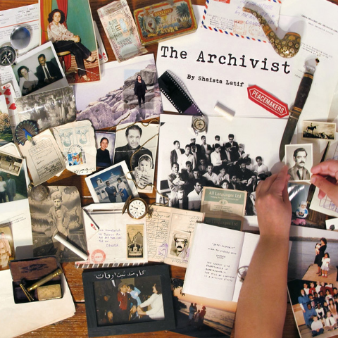 Collection of papers and photographs on a table.