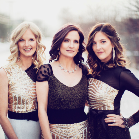 three beautiful sisters in a black and white picture