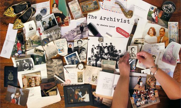 Collection of papers and photographs on a table.