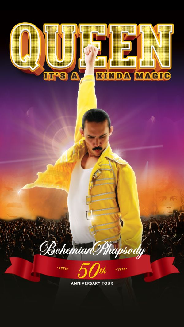 Freddy Mercury look a like in a yellow jacket with his hand raised