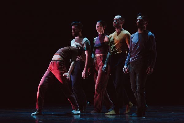 Dancers performing on a stage.