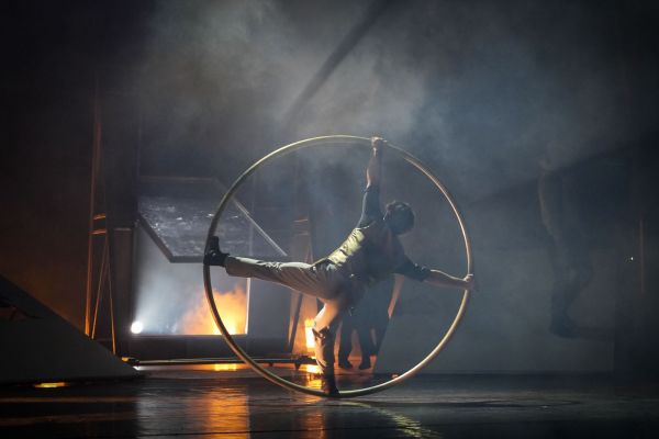 Dancers performing on a stage.